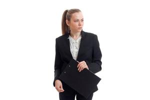 sexig företag lady i svart kostym utseende bort från de läsplatta i deras händer foto
