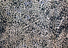 bakgrund med leopard textur, stänga upp. leopard färgade tyg. foto