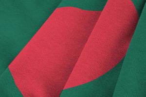 bangladesh flagga med stor veck vinka stänga upp under de studio ljus inomhus. de officiell symboler och färger i baner foto