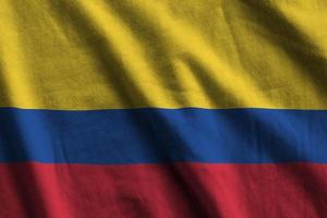 colombia flagga med stor veck vinka stänga upp under de studio ljus inomhus. de officiell symboler och färger i baner foto