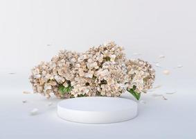 vit podium med skön blommor och flygande kronblad på de vit bakgrund. podium för produkt, kosmetisk presentation. kreativ falsk upp. piedestal eller plattform för skönhet Produkter. foto