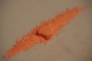 orange piller med mdma extas dopa rolex läkemedel stänga upp bakgrund bra konst i hög kvalitet skriva ut foto