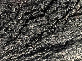 abstrakt bakgrund och textur av smutsig yta från de lera. antenn se av målning på de svart bakgrund foto