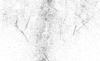 grunge svartvitt mönster. monokroma partiklar abstrakt konsistens. bakgrund av sprickor, repor, marker, fläckar, bläckfläckar, linjer. mörk design bakgrundsyta. foto