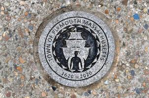 symbol av plymouth, massachusetts, USA med en inföding amerikan och de majblomma. foto