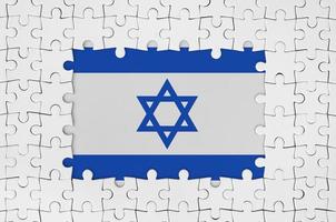 Israel flagga i ram av vit pussel bitar med saknas central del foto