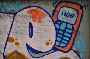 textur av en fragment av de vägg med graffiti målning, som är avbildad på Det. ett bild av en bit av graffiti teckning som en Foto på gata konst och graffiti kultur ämnen