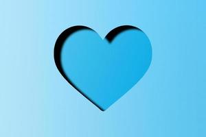 ljus blå papper skära in i en hjärta form, hjärtans dag festival foto