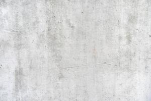 grå grov plåster vägg textur bakgrund, vit vägg detalj textur med svart fläckar foto