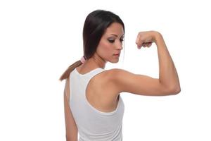 rong kondition idrottare, kvinna kroppsbyggare, böjning muskler, som visar passa kropp foto