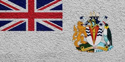 brittiskt antarktisk territorium flagga på en texturerad bakgrund. begrepp collage. foto