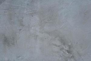 de cement golv har sprickor och mönster. foto