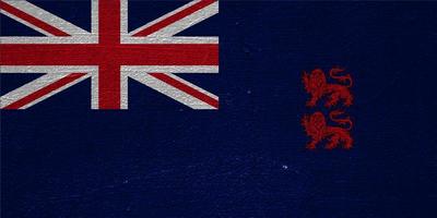 flagga av de brittiskt utomlands territorium av de officiellt de suverän bas områden av akrotiri och dhekelia på en texturerad bakgrund. begrepp collage. foto