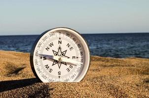 kompass i de sand foto