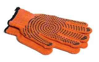 textil- orange arbete handskar på en vit bakgrund. skyddande Kläder för manuell arbetare foto