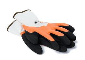 stickat handskar med latex beläggning till skydda mot mekanisk skada, fett och olja foto
