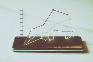 telefoner, och tabletter med terar stock tickers eller grafer, kryptovaluta och ny handel plattformar, idéer och perspektiv, stock investering, ny teknologi foto