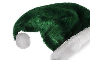jul hatt på en vit bakgrund. grön santa claus hatt med vit pompom. foto