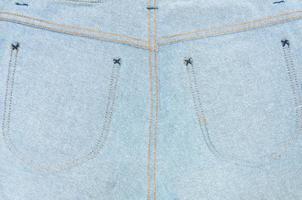 jeans textur med ficka, jeans denim textur och bakgrund, jeans av tillbaka foto