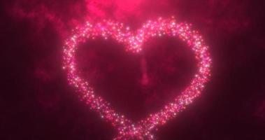 lysande röd kärlek hjärta tillverkad av partiklar på en röd festlig bakgrund för hjärtans dag foto