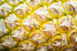 närbild av ananas frukt textur ananas hud bakgrund foto