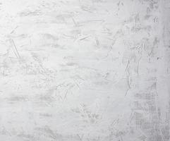 textur av grå vit cement vägg med spatel stötar, full ram foto