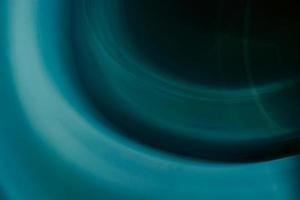 abstrakt bakgrund av cirklar och vågor i blå, turkos och mörk färger. foto