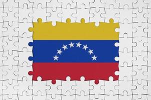 venezuela flagga i ram av vit pussel bitar med saknas central del foto