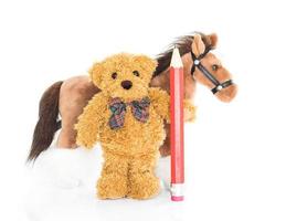 teddy Björn med röd penna och hästar foto