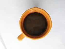 en glas av svart kaffe foto