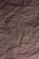 brun skrynklig pappersbakgrundsstruktur foto