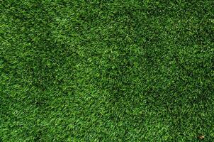 grön artificiell gräs textur för bakgrund foto