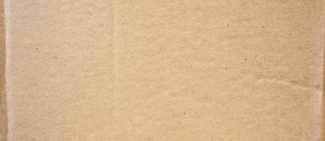 brun kartong ark abstrakt bakgrund. textur av återvinna papper låda. foto