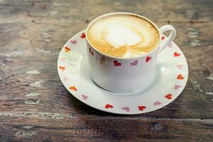 latte kaffe på trä tabell med Plats foto