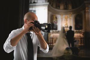 professionell fotograf i en bröllop foto