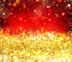 jul lysande guld och röd bakgrund foto