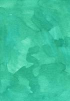vattenfärg smaragd- bakgrund textur. akvarell marin grön Färg bakgrund. fläckar på papper foto