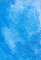 vattenfärg lugna blå bakgrund målning textur. fläckar på papper. foto