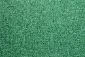 abstrakt design bakgrund av grön smaragd- grovkornig genomskärning textur av grov tyg med ett sammanflätning. Linné säck textil- duk säckväv trasa. närbild, falsk upp, topp se foto