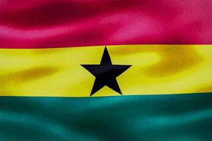 ghana flagga - realistiskt viftande tygflagga foto