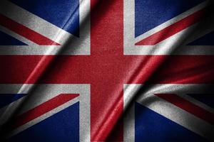 de vågande av flagga av storbritannien silke flagga, och engelsk flagga begrepp design foto