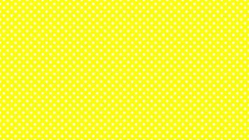 vit polka prickar över gul bakgrund foto