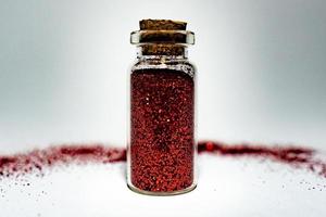 glitter glas dekorativ röd glans burk skimmer juveler foto