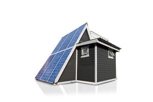 sol- paneler på en hus tak isolerat på vit bakgrund. alternativ elektricitet källa - hållbar Resurser begrepp. foto