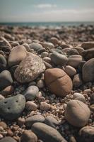 sten stenar på de strand - mjuk fokus med årgång filtrera foto