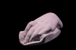hand skulptur isolerat på svart bakgrund foto