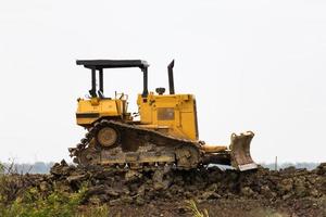 bulldozer maskin i webbplats foto