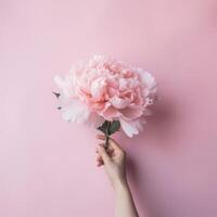 hand med rosa pion blomma. illustration ai generativ foto