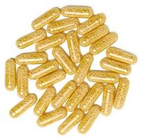 transparent medicinsk kapslar med gul granulat inuti på en vit bakgrund, tabletter för behandling, vitaminer foto