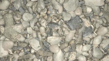 stor krossad sten sten väg byggnad material grus textur. små sten konstruktion material sten. en lugg av stenar och småsten på de jord, material korall sten för de väg fundament lager, foto